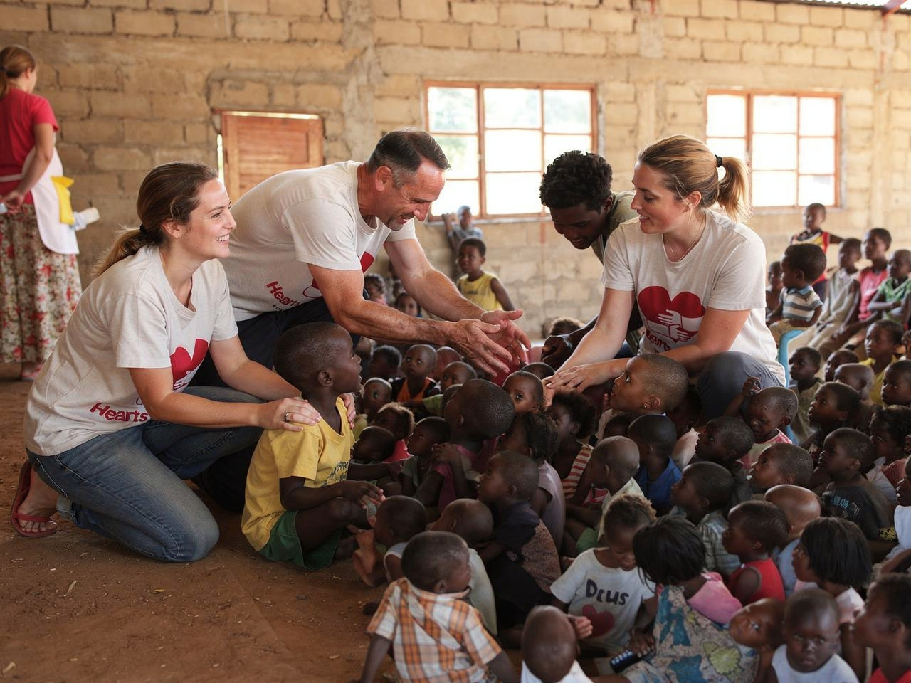 Hearts of Africa volunteers with children